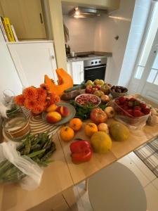 a table full of fruits and vegetables on a counter at JScAsa Rainha Centro in Caldas da Rainha +11 photos
