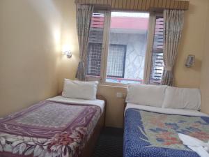 Katil atau katil-katil dalam bilik di Hotel Celestyinn