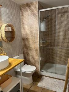 a bathroom with a shower and a toilet and a sink at Calonge Ca la Noni in Calonge +14 photos