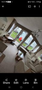 an overhead view of a living room with a large window at Metcalfes family caravan in Heysham