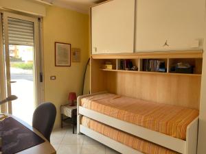 a bedroom with a bed and a cabinet and a door at Casa Sofia in Termoli