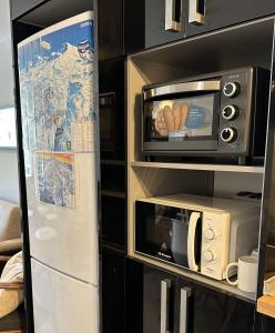 A kitchen or kitchenette at Sierra Nevada Hostel