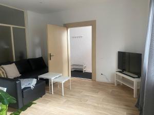 TV a/nebo společenská místnost v ubytování Terassenwohnung in Weilerbach