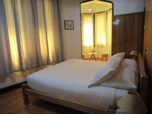 Postel nebo postele na pokoji v ubytování Hotel Vegas