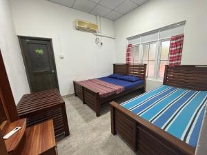 Letto o letti in una camera di The Beach House , Nilaveli , Trincomalee