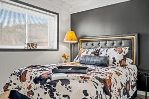 a bedroom with a large bed and a window at Corner Unit Balcony Free Tix Gatlinburg in Gatlinburg