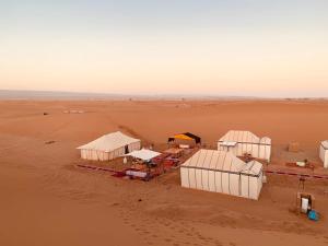 an aerial view of tents in the desert at Camp Sahara Majestic in Mhamid