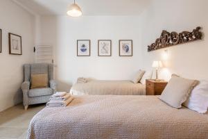 A bed or beds in a room at Appartamenti Anguria Toscana