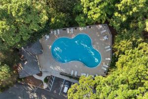 an overhead view of a building with a blue pool at Pointe of View 407- Penn's Paradise in Destin