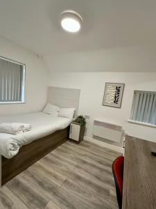 Ένα ή περισσότερα κρεβάτια σε δωμάτιο στο Lancaster Apartment