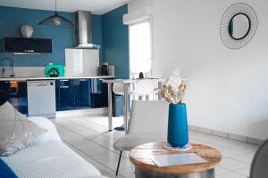 Kuchyňa alebo kuchynka v ubytovaní Bel appartement climatisé & parking