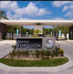 a sign for the mariana turnulska headquarters at Casas Marina Turquesa in Cancún