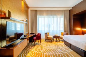Uma cama ou camas num quarto em Asiana Hotel Dubai