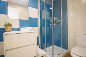a bathroom with a shower and a toilet at Capri 403 in Torrox Costa +27 photos