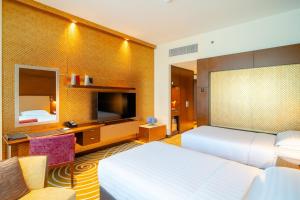 Uma cama ou camas num quarto em Asiana Hotel Dubai
