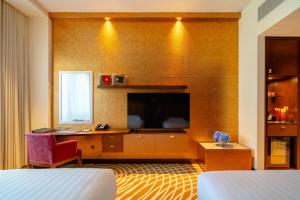 Uma televisão e/ou sistema de entretenimento em Asiana Hotel Dubai