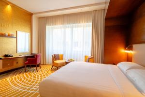 Uma cama ou camas num quarto em Asiana Hotel Dubai