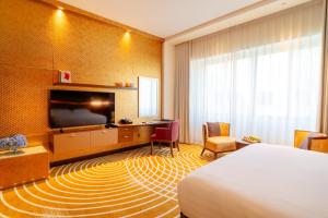 Uma televisão e/ou sistema de entretenimento em Asiana Hotel Dubai