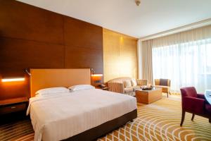 Uma cama ou camas num quarto em Asiana Hotel Dubai