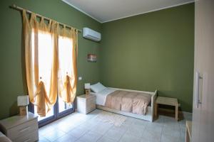 Postel nebo postele na pokoji v ubytování B&B LAVIKA PEDARA