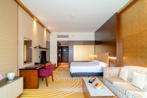 Uma cama ou camas num quarto em Asiana Hotel Dubai