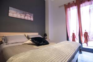 Postel nebo postele na pokoji v ubytování B&B LAVIKA PEDARA