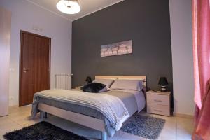 Postel nebo postele na pokoji v ubytování B&B LAVIKA PEDARA