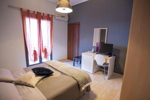 Postel nebo postele na pokoji v ubytování B&B LAVIKA PEDARA