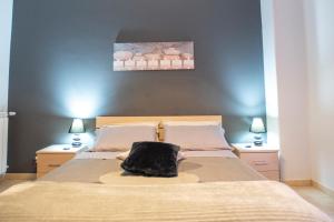 Postel nebo postele na pokoji v ubytování B&B LAVIKA PEDARA