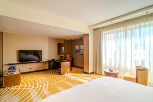 Uma televisão e/ou sistema de entretenimento em Asiana Hotel Dubai