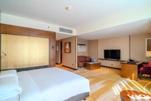 Uma televisão e/ou sistema de entretenimento em Asiana Hotel Dubai