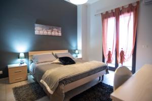 Postel nebo postele na pokoji v ubytování B&B LAVIKA PEDARA