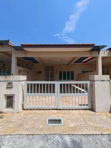 a house with a white gate in front of it at H&Z Guesthouse Kulim Hi-Tech - Free Wifi - Netflix in Kulim