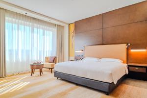 Uma cama ou camas num quarto em Asiana Hotel Dubai