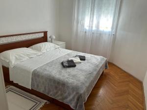 Postel nebo postele na pokoji v ubytování Apartman Mirna