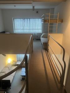 Postel nebo postele na pokoji v ubytování Tomamu Hostel + 10 fotografií