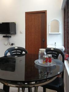 Μια τηλεόραση ή/και κέντρο ψυχαγωγίας στο Holidays Homestay Vagamon +4 φωτογραφίες