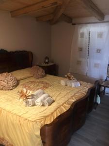 a bedroom with a bed with stuffed animals on it at Lovely Country House in Trappeto +21 photos