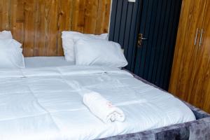A bed or beds in a room at Diganga Reloaded