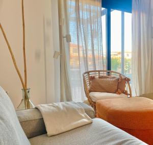 a living room with a couch and a window at Mi Casa in Majanicho
