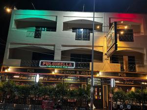 a building with a sign in front of it at night at Home Sweet Home 3 in Pattaya South