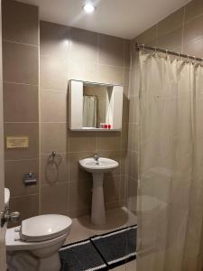 a bathroom with a toilet and a sink and a shower at Home Sweet Home 3 in Pattaya South