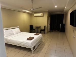 a bedroom with a bed and a table with chairs at Home Sweet Home 3 in Pattaya South +6 photos