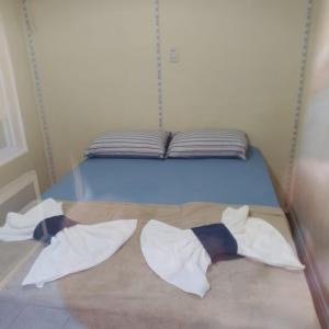 Postelja oz. postelje v sobi nastanitve Casa em Florianópolis pé na areia com sauna