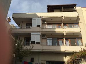 an apartment building with balconies on the side of it at Hotel Efes in Gumuldur