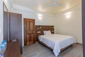 Voodi või voodid majutusasutuse Dhoadhi Beach Maldives toas