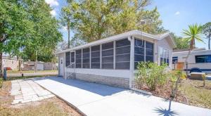 a white house with a lot of windows at Amazing 1 bedroom Near Disney in Seven Points