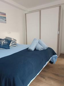 En eller flere senge i et værelse på Alojamiento Marinero, La Paranza