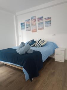 En eller flere senge i et værelse på Alojamiento Marinero, La Paranza