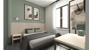 a bedroom with a bed and a desk in it at DUCATO HOTEL e RESIDENCE in San Polo